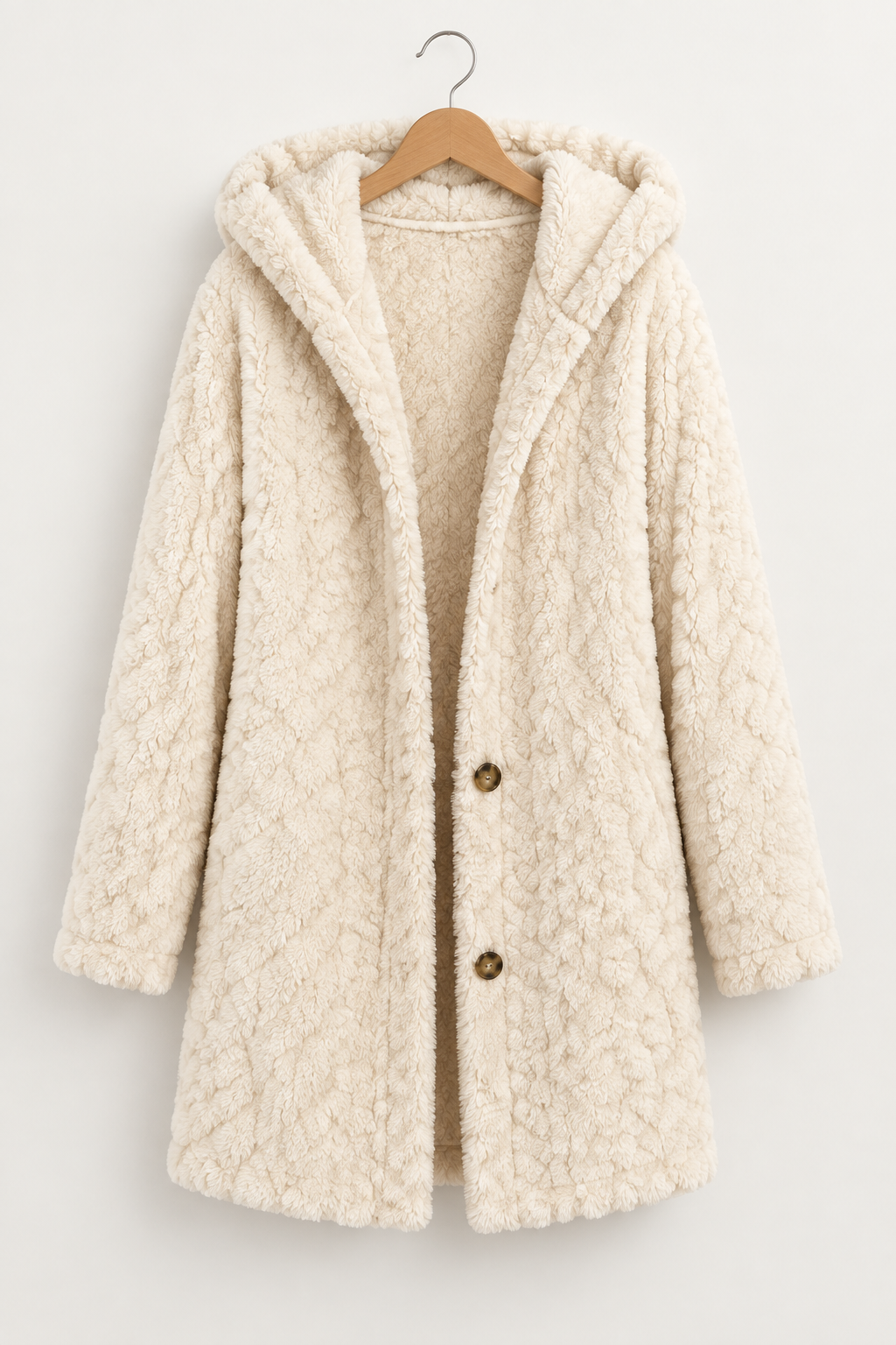 Cream fuzzy hooded coat on a hanger