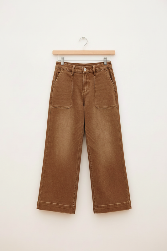 Cropped wide-leg jeans on a flat wooden pants hanger