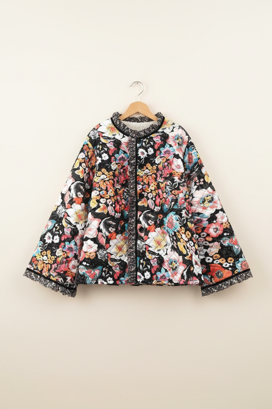 Floral quilted sherpa-lined jacket on a wooden hanger