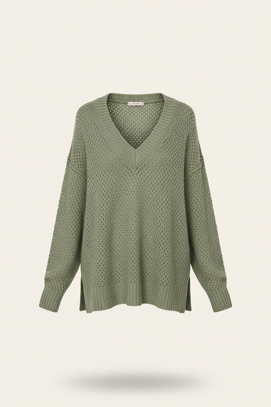 Sage-green open-knit V-neck sweater on a plain warm-white background