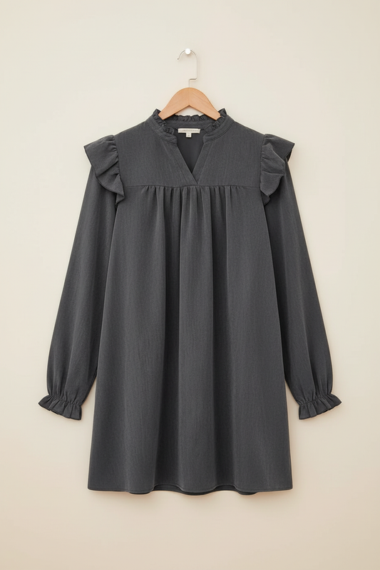 Slate ruffle mini dress on a wooden hanger