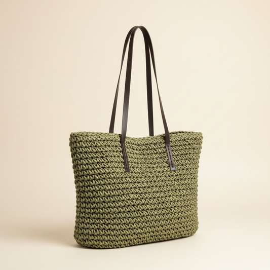 Woven straw bag with exactly two straps on a blank background